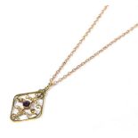 An Art Nouveau amethyst and seed pearl pendant on a trace link chain, pendant measures 2.5cm by 4.