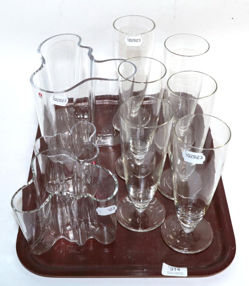 A graduated set of three Alvar Aalto ''Savoy'' glass vases; and a set of six tall pedestal glasses