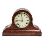 A late Victorian walnut veneered striking mantel clock