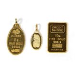 Two pendants stamped 'Fine Gold' and a gold bar (3) . Gross weight 16.33 grams.