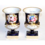 A pair of Chamberlains Worcester floral painted urns