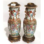 A pair of 19th century Canton Famille rose vases, converted to table lamps with gilt metal