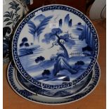 Three Japanese blue and white chargers decorated with birds, trees and pagodas
