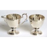 A George V silver cream-jug and sugar-bowl, by Adie Brothers, Birmingham, 1928, each piece