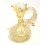 A Venetian glass jug, applied dragon handle and mottled gilt decorationThe neck of the jug with