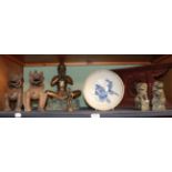 A group of Oriental statues and models including a pair of Chinese soapstone temple lions, a pair of
