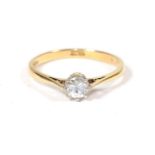 An 18 carat gold solitaire diamond ring, a round brilliant cut diamond in a claw setting, to knife