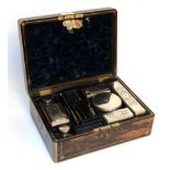 A William IV silver-mounted dressing table-set, the silver mounts London, 1831, contained in a