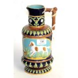 A 19th century George Jones Majolica hunting jug with stylised whip-form handle and decorated in