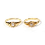 An 18 carat gold diamond solitaire ring, finger size M1/2; and a diamond solitaire ring, stamped '