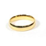 An 18 carat gold band ring, finger size V. Gross weight 8.24 grams.