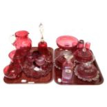 Two trays of 19th century cranberry glass including a small mug decorated with gilt filled engraving