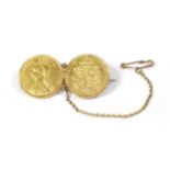 A double shield back sovereign brooch, length 3.8cm, boxed . Gross weight 9.50 grams.