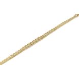 A 9 carat gold graduated curb link bracelet, length 19cm. Gross weight 14.09 grams.