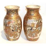 A near pair of Meji period Japanese satsuma vases, panels decorated with daimyo and warriors,