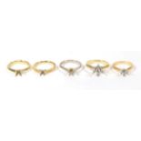 An 18 carat white gold vacant ring mount; and four 18 carat gold vacant ring mounts, varying