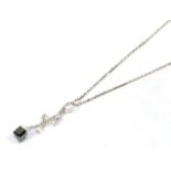 A white and black diamond pendant, marks indistinct, on a platinum chain, pendant length 3cm,