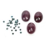 Three loose cabochon ruby type stones; and thirty two loose blue faceted diamonds