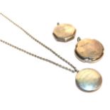 Three small silver pendant powder compacts (one on a chain) (3). Gross weight - 80.0 grams.