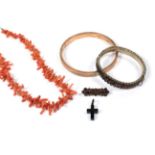 A jet cross; a 9 carat gold bangle (a.f.); a coral branch necklace; a heart shaped turquoise set