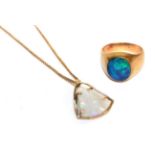 An opal triplet signet ring, stamped '9CT, finger size U; and an opal pendant on a gold plated