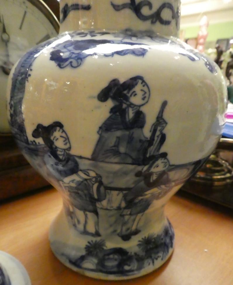 A 19th century Chinese blue and white figural vase and cover Vase and cover with firing blemish - Image 4 of 7