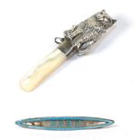 A George V silver and mother-of-pearl rattle, by H. Matthews, Birmingham, 1910, surmounted by a cat,