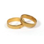 Two 22 carat gold band rings, L1/2 and M (2). Gross weight 7.2g .