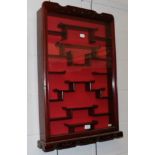 A Chinese style rosewood glazed hanging display cabinet