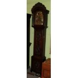 An eight day longcase clock signed Wm Sproston Trelleck, moonphase dial, later oak carved case