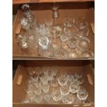 A quantity of drinking glasses and decanters including a pair of waisted cut glass decanters and