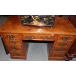 An Edwardian oak pedestal desk