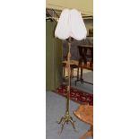 Late Victorian brass adjustable standard lamp, with four paw feet