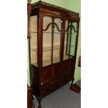 An early 20th century mahogany display cabinet 197cm high by 124cm wide by 35cm deep.