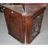 An oak glazed corner cupboard; and an early 19th century corner cupboard (2)