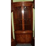 A 20th century mahogany display corner cabinet