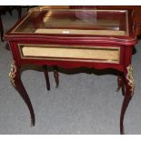 A reproduction French style gilt metal mounted bijouterie table, 82cm wide