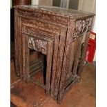 A nest of four early 20th century carved nesting tables in the Oriental style, largest table 53cm by