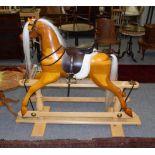 A modern rocking horse, the base with metal plaque stamped Rocking Horse Makers and Restorers