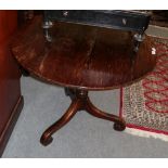 A George III oak tilt top tripod table