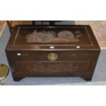 An Oriental camphor wood carved blanket chest