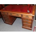 A late Victorian mahogany pedestal desk The surfaces are faded in parts. Some scratches. One