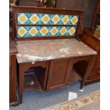 A Victorian wash stand with floral decorated tiles and marble top