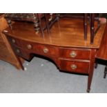 An Edwardian mahogany bow-fronted side table