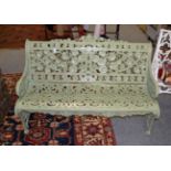 A reproduction green painted metal garden seat, 130cm wide