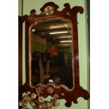 A Regency style mahogany gilt painted wall mirror