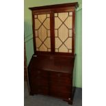 A George III style mahogany secretaire bookcase