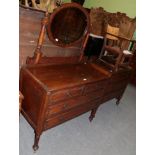 An early 20th century mirror backed dressing table; and a matching three height oak chest of drawers