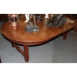 A late Victorian oak extending table by James Rodwell, with two additional leaves, raised on