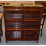 A three tier mahogany sectional bookcase